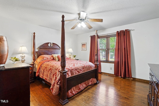 203 Marlowe Dr, Dunn, NC 28334 - bedroom featuring dark wood-style floors, ceiling fan, a textured ceiling, and baseboards