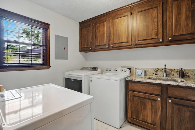 203 Marlowe Dr, Dunn, NC 28334 - washroom featuring washer and dryer, cabinet space, electric panel, and a textured ceiling