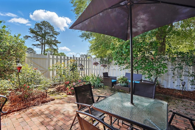 203 Marlowe Dr, Dunn, NC 28334 - view of patio with outdoor dining area and a fenced backyard