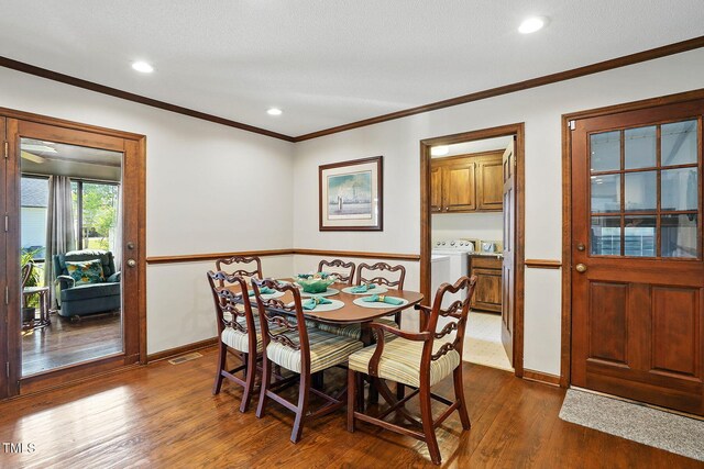 203 Marlowe Dr, Dunn, NC 28334 - dining space featuring dark wood-style flooring, ornamental molding, baseboards, and recessed lighting