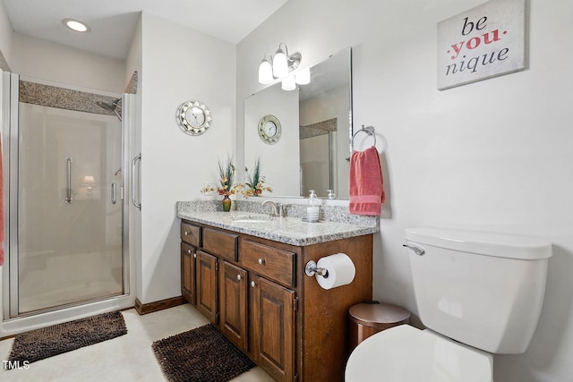 203 Marlowe Dr, Dunn, NC 28334 - bathroom featuring a shower stall, toilet, vanity, and recessed lighting