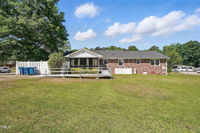203 Marlowe Dr, Dunn, NC 28334 - rear view of house featuring a sunroom and brick siding