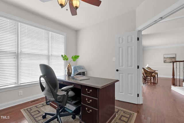 home office with ceiling fan, baseboards, dark wood-style floors, and crown molding