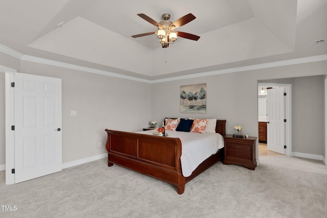 bedroom featuring a raised ceiling, light carpet, baseboards, crown molding, and a ceiling fan