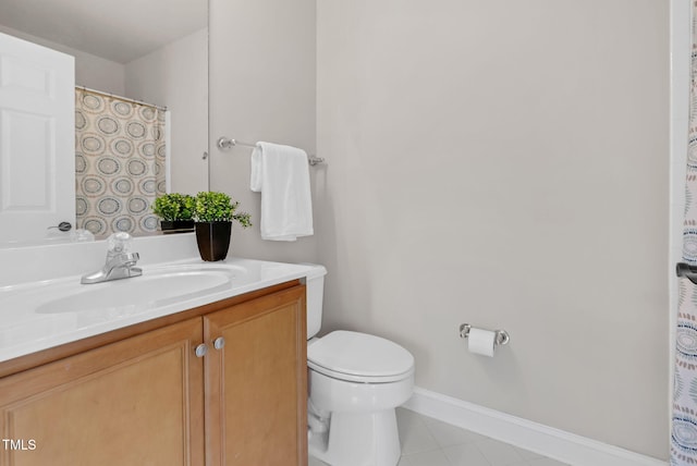 full bathroom featuring toilet, baseboards, vanity, and tile patterned floors