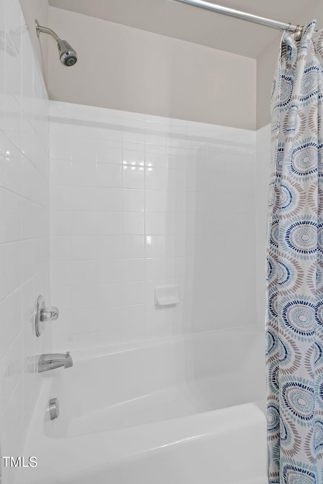 bathroom with shower / bath combination with curtain