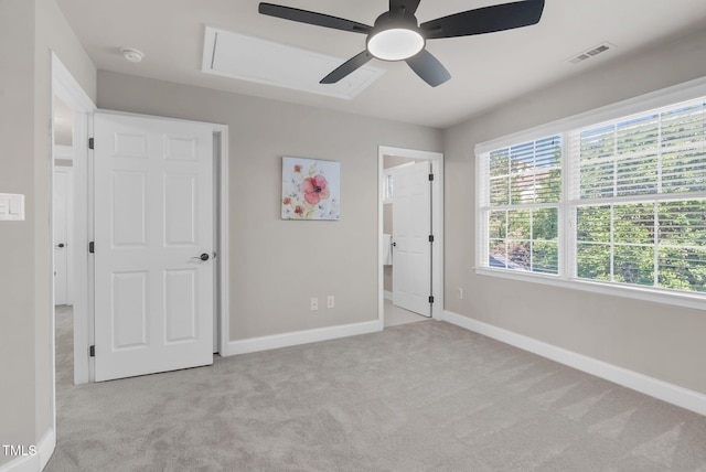 unfurnished bedroom featuring carpet flooring, baseboards, and ceiling fan