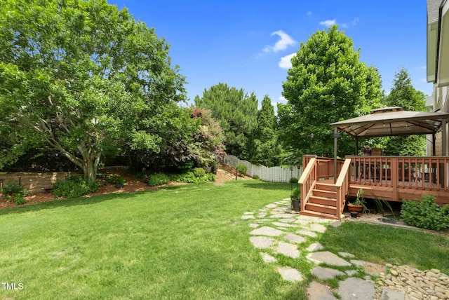 view of yard featuring a gazebo and a deck
