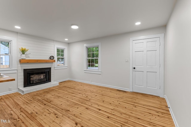 306 Coleman St, Oxford, NC 27565 - unfurnished living room with a fireplace, hardwood / wood-style floors, recessed lighting, and baseboards