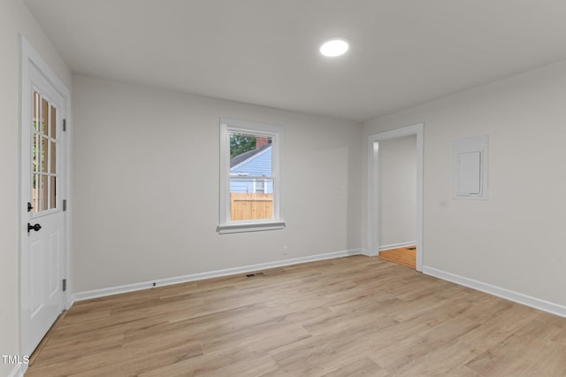 306 Coleman St, Oxford, NC 27565 - empty room featuring light wood-style flooring, baseboards, and electric panel