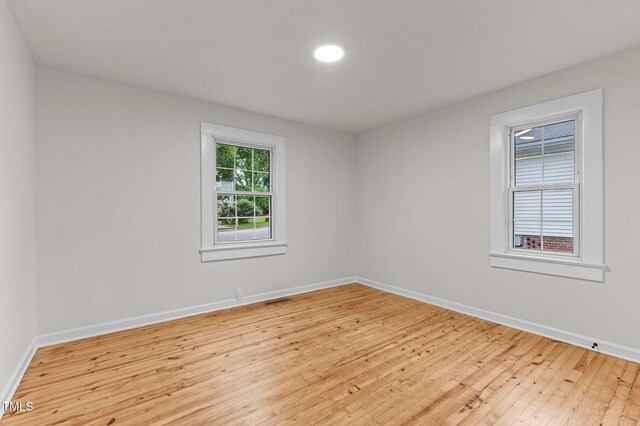 306 Coleman St, Oxford, NC 27565 - spare room featuring baseboards and light wood-style flooring