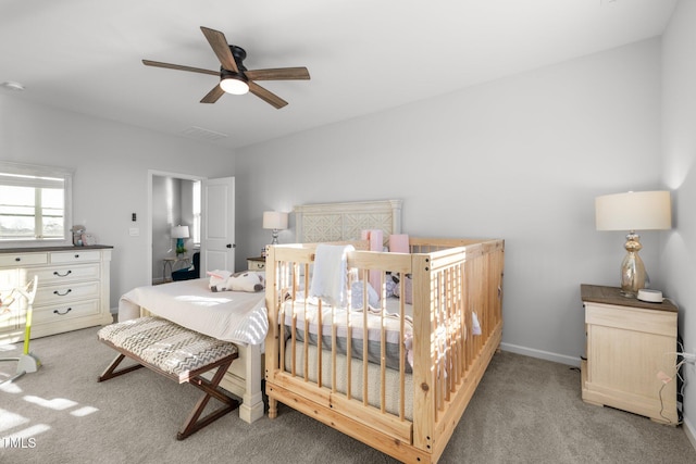 carpeted bedroom with ceiling fan