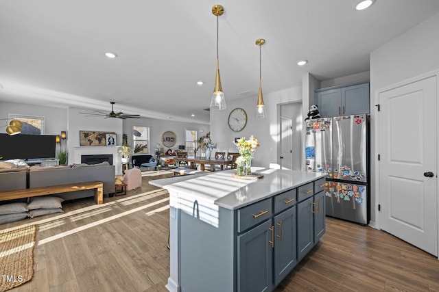 kitchen with freestanding refrigerator, ceiling fan, open floor plan, dark wood finished floors, and recessed lighting