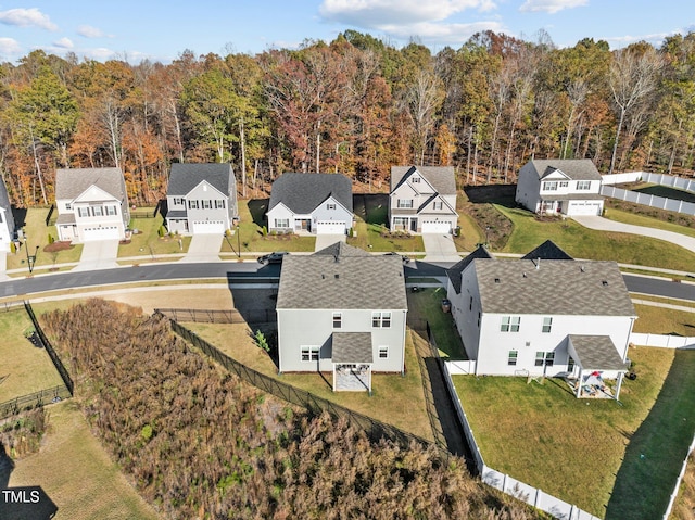 aerial view of residential area with a heavily wooded area