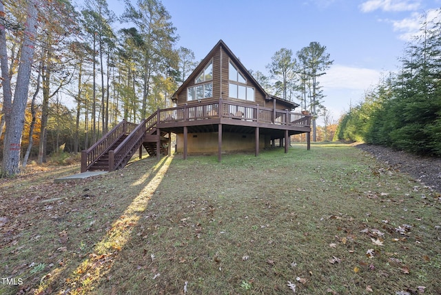 50 Tyler Ct, Henderson, NC 27537 - back of property featuring a wooden deck and stairway