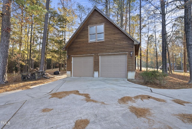 50 Tyler Ct, Henderson, NC 27537 - garage with driveway and a garage