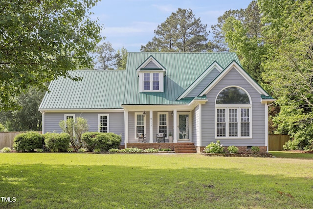 view of front facade with covered porch and metal roof