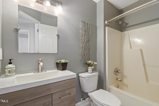 bathroom with toilet, vanity, and tub / shower combination