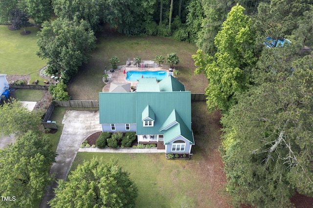 view of subject property with a pool area