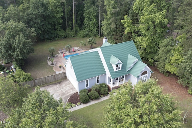 view from above of property with a forest
