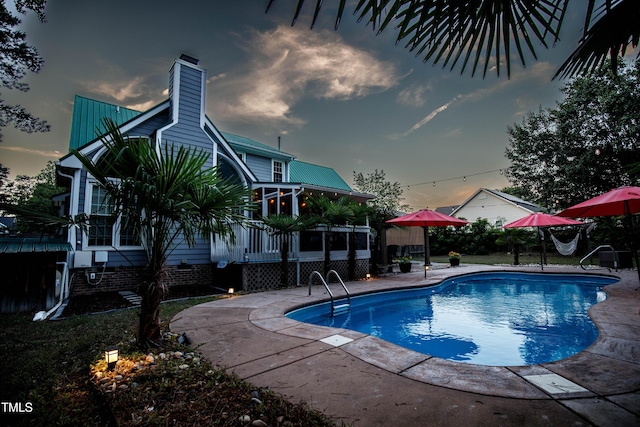 swimming pool featuring a patio area