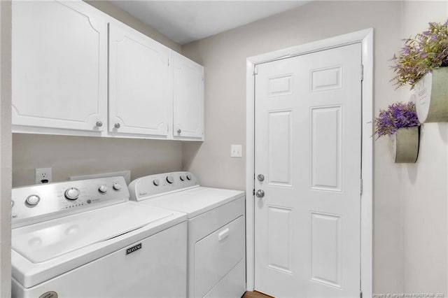 laundry area with washing machine and dryer and cabinet space
