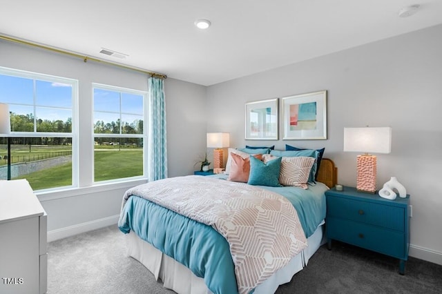 bedroom featuring carpet flooring and baseboards