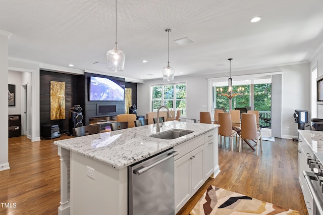kitchen with a sink, dishwasher, crown molding, white cabinetry, and recessed lighting