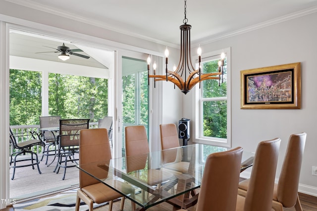 dining area with a chandelier, a ceiling fan, ornamental molding, and baseboards