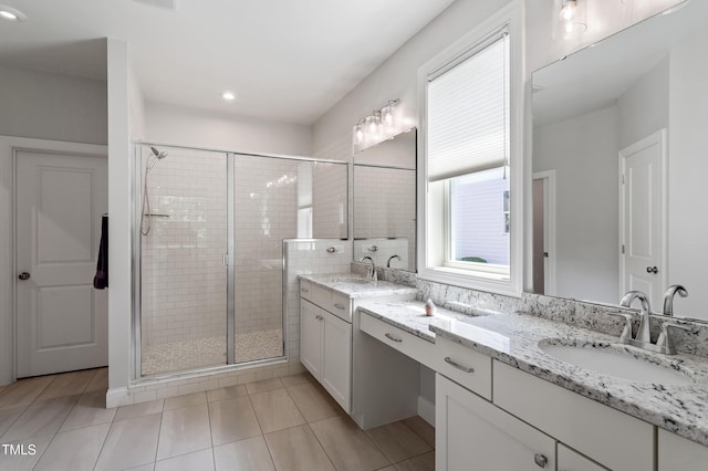 bathroom with a stall shower, tile patterned flooring, double vanity, and recessed lighting
