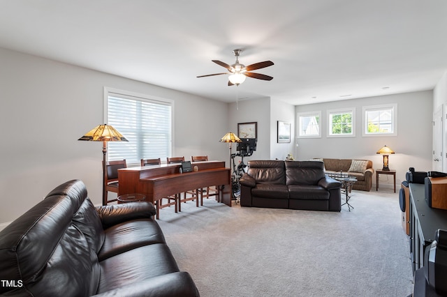 living room featuring ceiling fan and light colored carpet