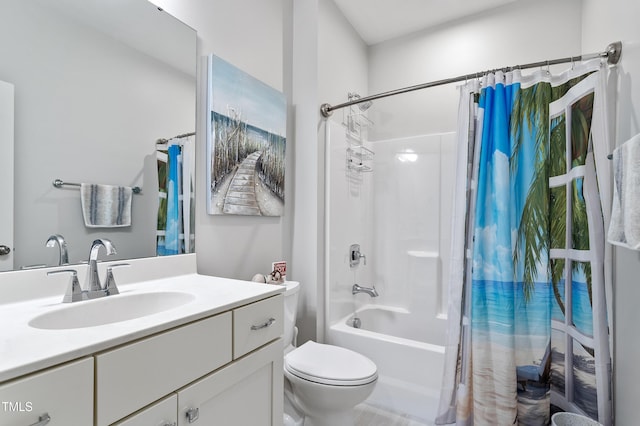 bathroom with shower / tub combo with curtain, vanity, and toilet