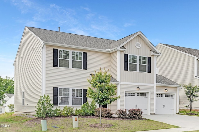 69 Curling Creek Dr Unit I286, Clayton, NC 27527 - traditional-style home with an attached garage, concrete driveway, a shingled roof, and board and batten siding