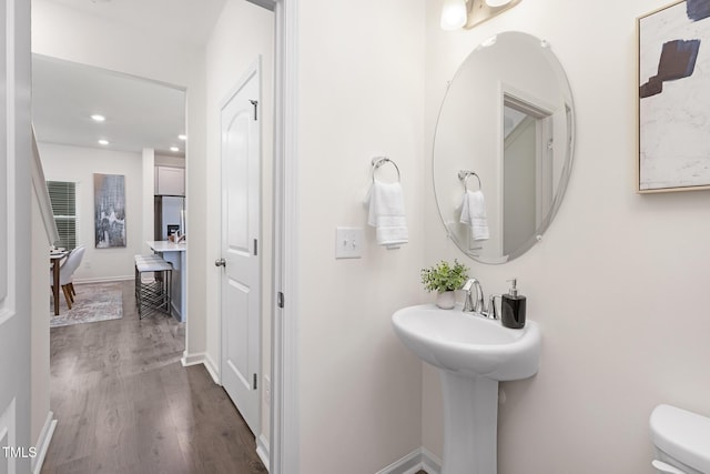 69 Curling Creek Dr Unit I286, Clayton, NC 27527 - bathroom with wood finished floors, recessed lighting, toilet, and baseboards