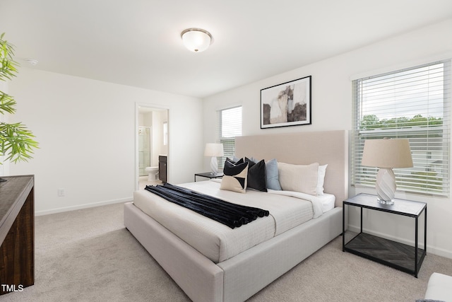 69 Curling Creek Dr Unit I286, Clayton, NC 27527 - carpeted bedroom with baseboards and ensuite bath