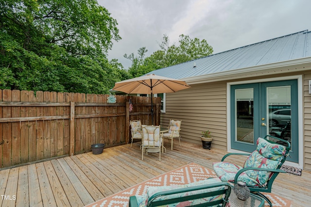 wooden deck featuring french doors and fence
