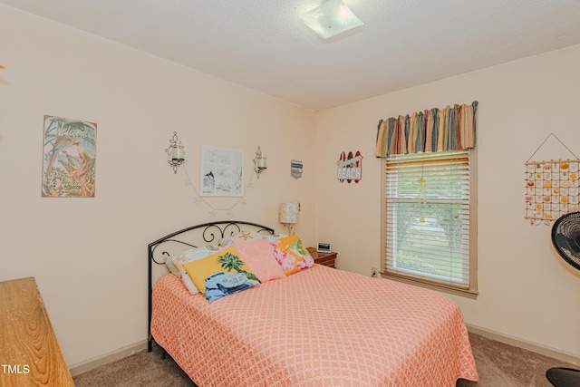 bedroom with carpet floors and baseboards