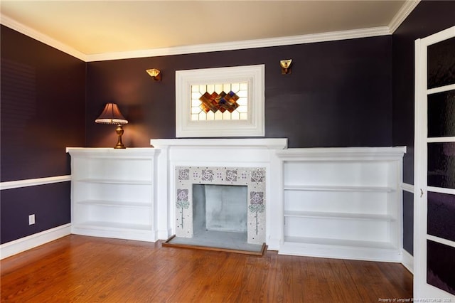 305 N Fayetteville St, Parkton, NC 28371 - unfurnished living room featuring a tile fireplace, wood finished floors, baseboards, and crown molding