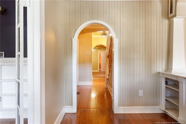 305 N Fayetteville St, Parkton, NC 28371 - corridor featuring arched walkways, hardwood / wood-style flooring, and baseboards