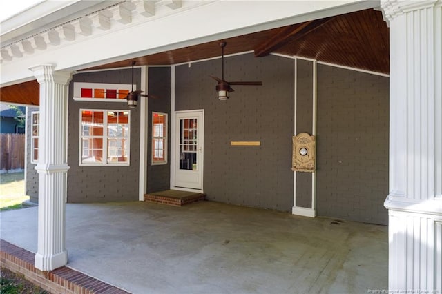 305 N Fayetteville St, Parkton, NC 28371 - view of exterior entry featuring a ceiling fan, board and batten siding, and brick siding