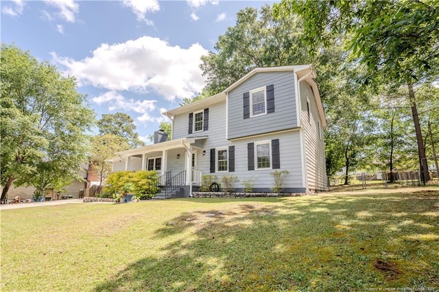 view of front of property featuring a front lawn and a chimney