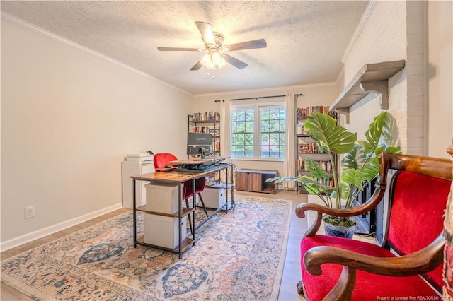office with ceiling fan, a textured ceiling, wood finished floors, ornamental molding, and baseboards
