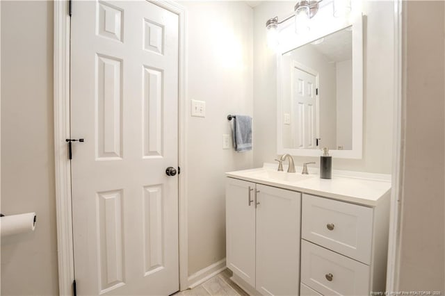 bathroom with vanity and baseboards