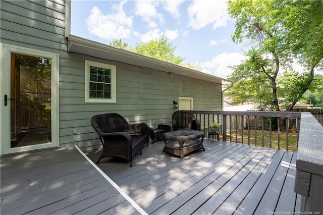 wooden terrace featuring an outdoor living space