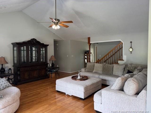 49 Pebble Beach Pt, Sanford, NC 27332 - living area featuring vaulted ceiling, ceiling fan, light wood-type flooring, and stairs