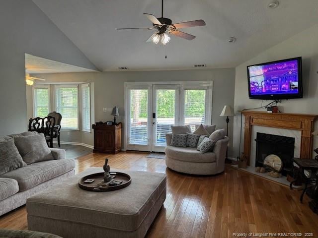 49 Pebble Beach Pt, Sanford, NC 27332 - living room featuring ceiling fan, healthy amount of natural light, wood finished floors, and high vaulted ceiling