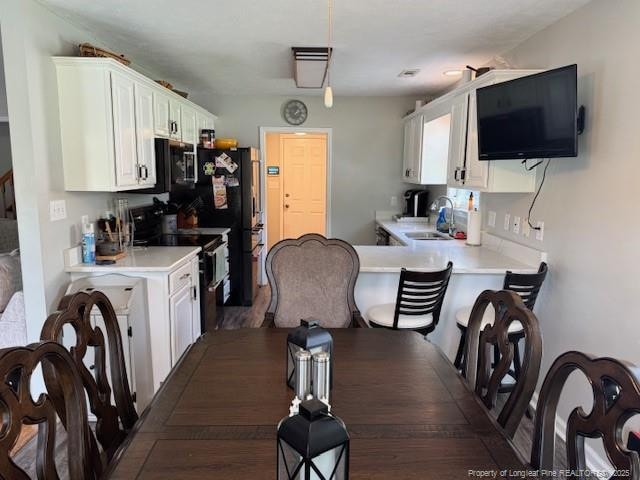 49 Pebble Beach Pt, Sanford, NC 27332 - dining area featuring dark wood-style flooring
