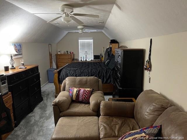 49 Pebble Beach Pt, Sanford, NC 27332 - bedroom with light colored carpet, lofted ceiling, ceiling fan, and a textured ceiling