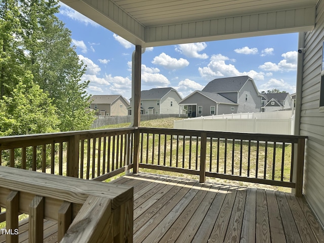 wooden deck featuring a residential view