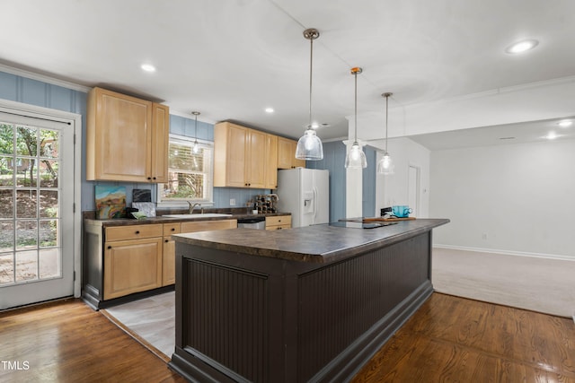 334 Westview Dr, Fayetteville, NC 28303 - kitchen featuring white refrigerator with ice dispenser, dark countertops, light brown cabinetry, a center island, and ornamental molding